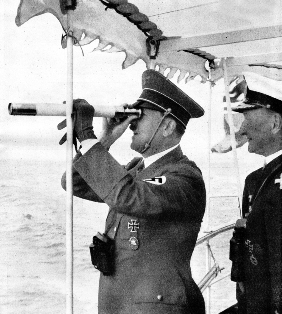 Adolf Hitler watches the Olympic sailing race on board of the Nixe yacht, with admiral Friedrich Götting